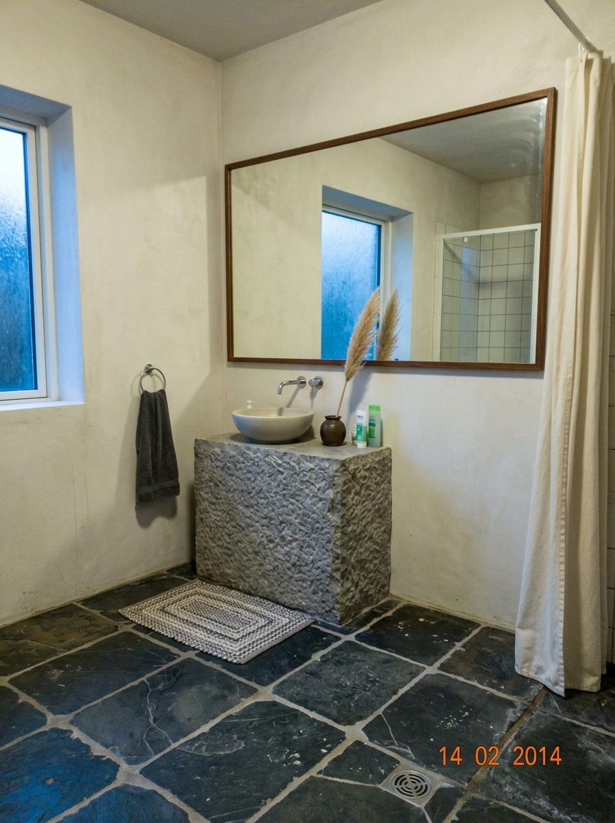 Inside A Bathroom With A Large Japandi Bathroom Mirror